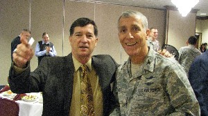 Luncheon attendee Joe Kahoe (l) meets with Col. Phil Platt, USAF, chapter president, at the January meeting.